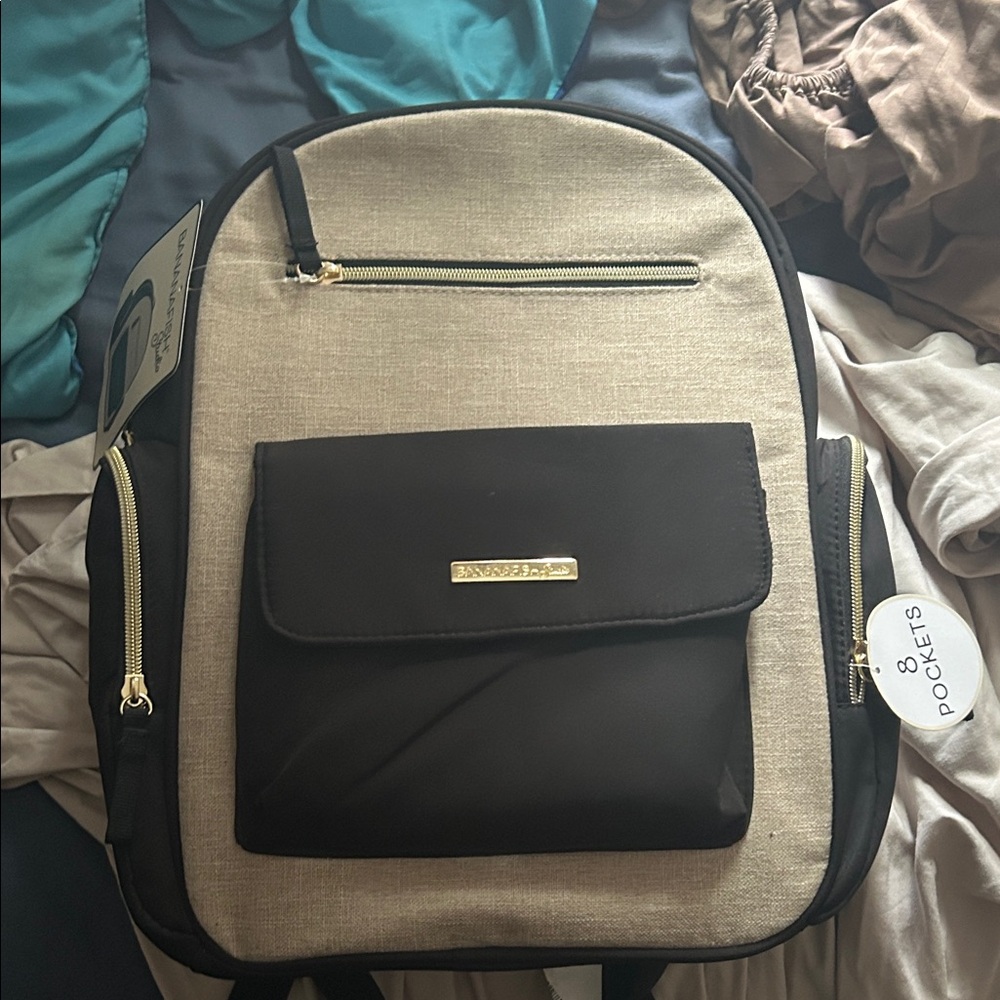 Kenneth Cole Black and Tan Backpack with Gold Zippers